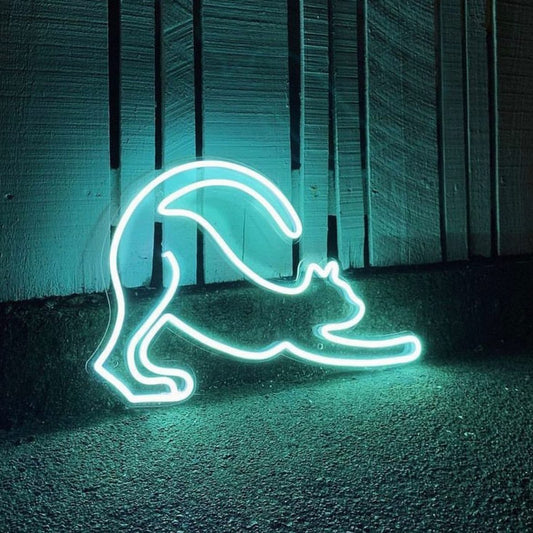 neon light of cat stretching out