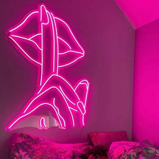 Shhhhh... Neon Sign - a sign with fingers pointing up to the lips with the movement of shhh